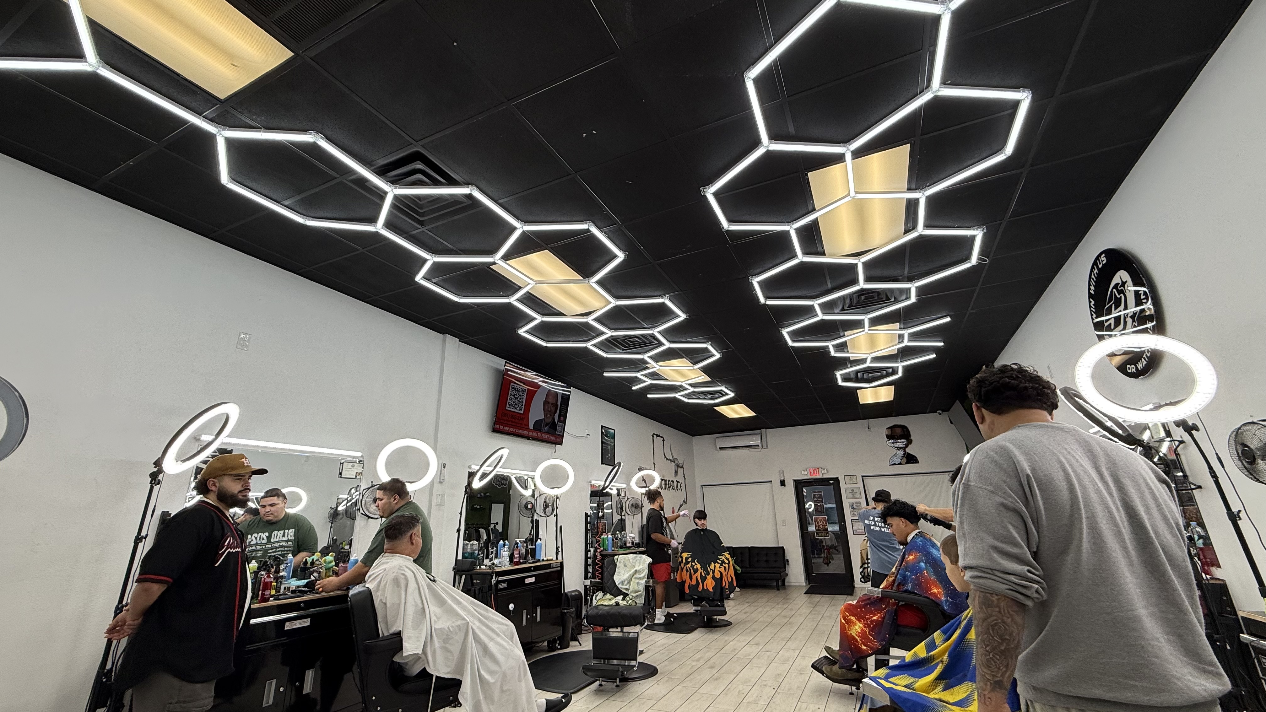 Adventure Media screen inside Local barber shop